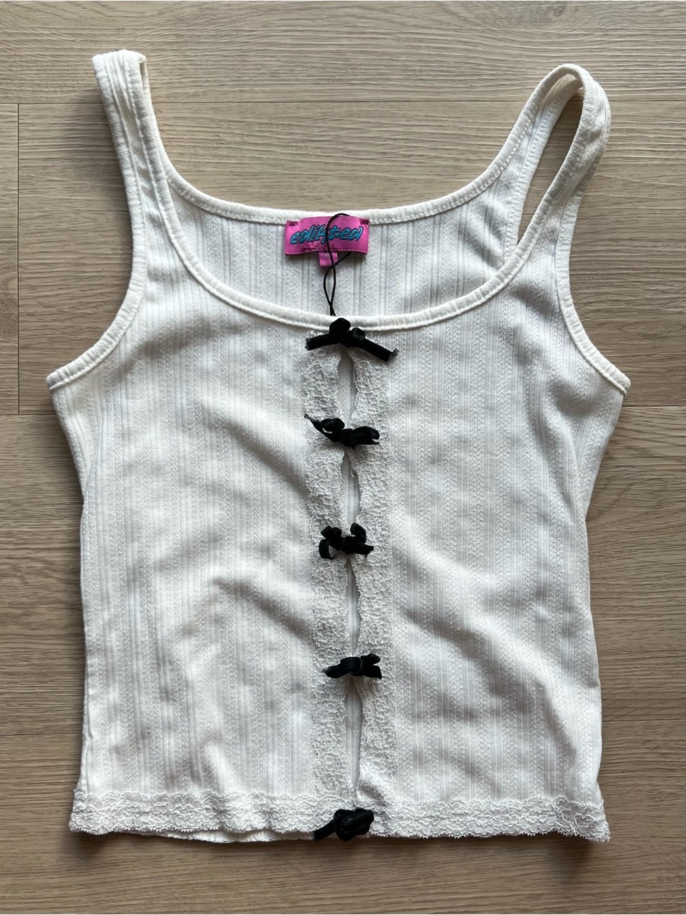 Edikted white ribbed tank with black bow accents
